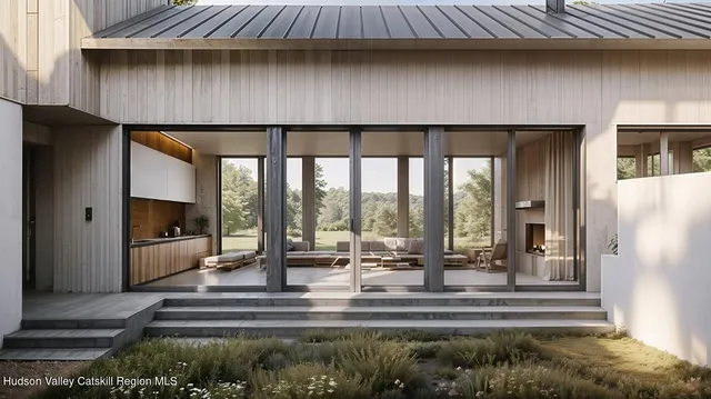 a living room with a floor to ceiling window and a fireplace