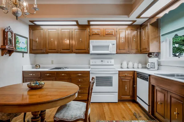 a living room with furniture and a book shelf