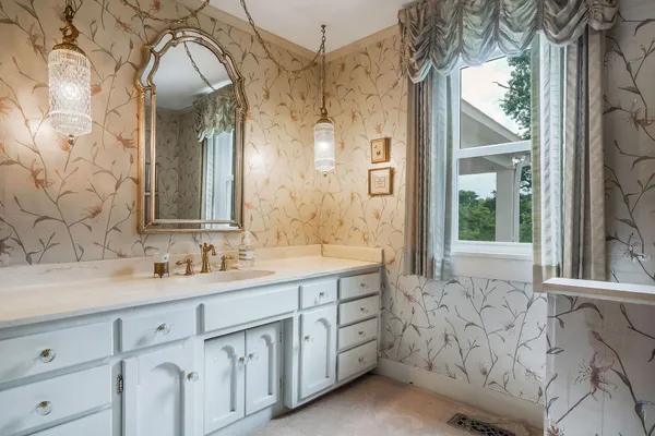 a room with a dresser and a window