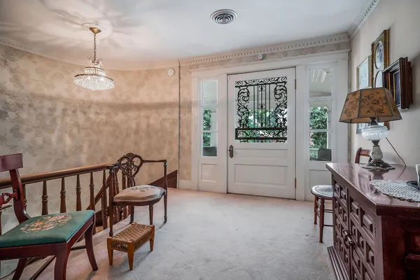 a white toilet sitting next to a bathroom sink