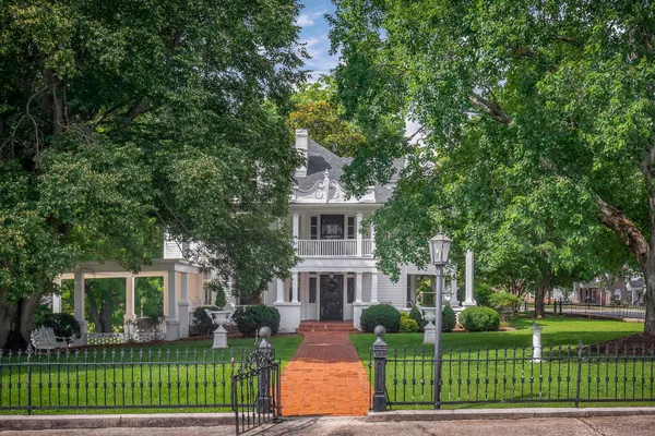 front view of a house with a garden