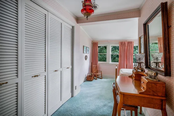 a bathroom with a granite countertop sink a mirror and a shower