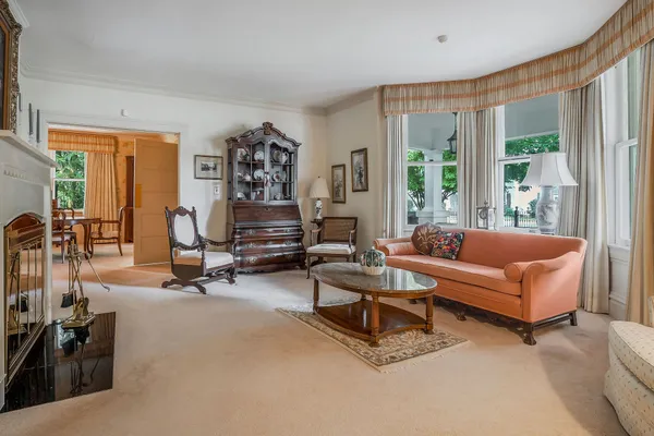 a view of a dining room with furniture window and outside view