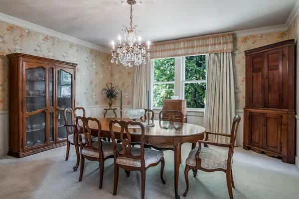 a kitchen with stainless steel appliances granite countertop a sink and a refrigerator