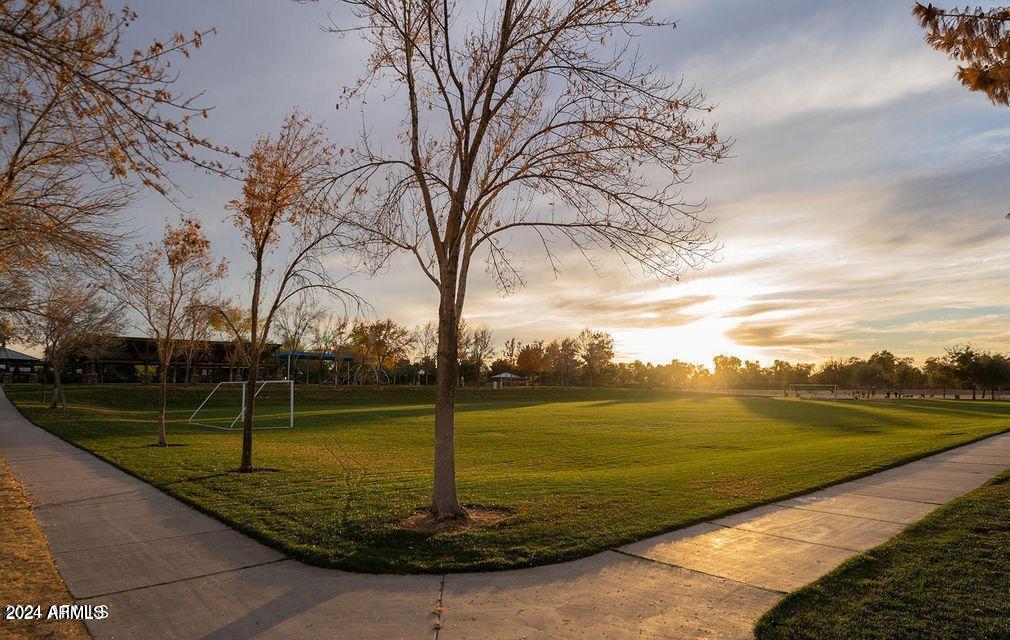 4757 East Waterman Street, Unit 103 Gilbert, AZ 85297 - Photo 15 of 27 a view of a lake with a yard