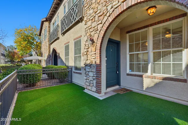a view of a house with a backyard and porch