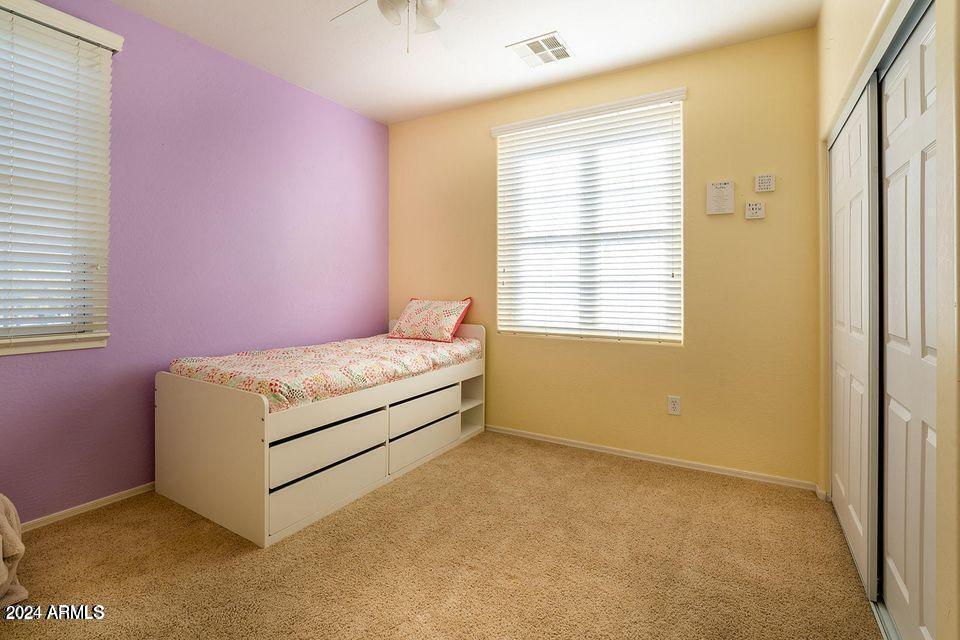 4757 East Waterman Street, Unit 103 Gilbert, AZ 85297 - Photo 21 of 27 a room with a bed and a window