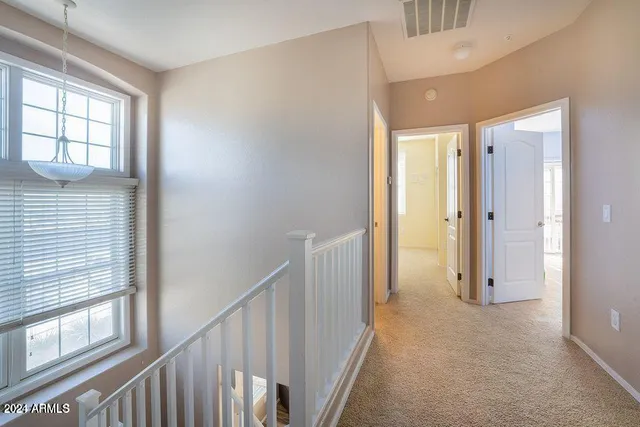a view of a hallway with an entryway