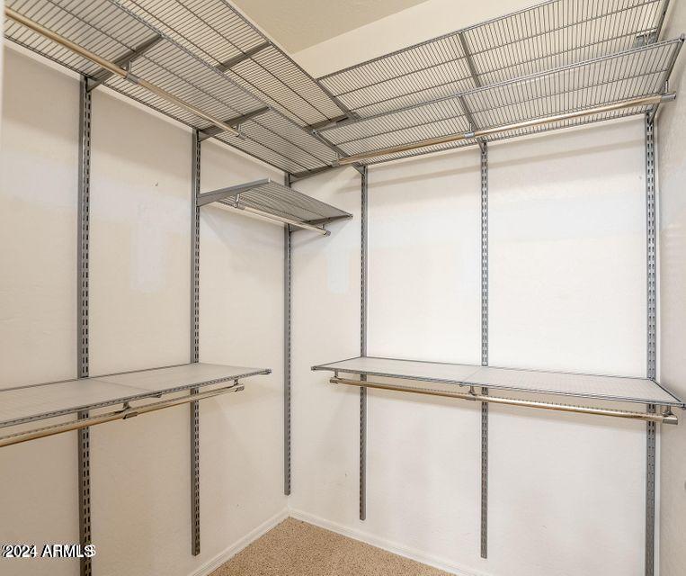4757 East Waterman Street, Unit 103 Gilbert, AZ 85297 - Photo 25 of 27 a view of a room with rack on the wall