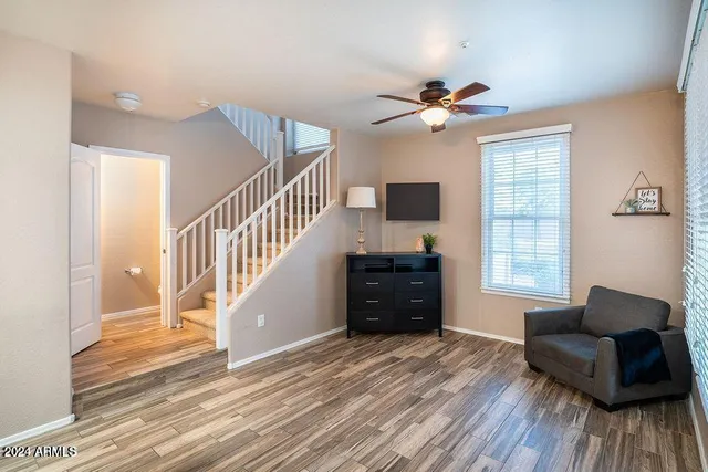 a living room with furniture and a window
