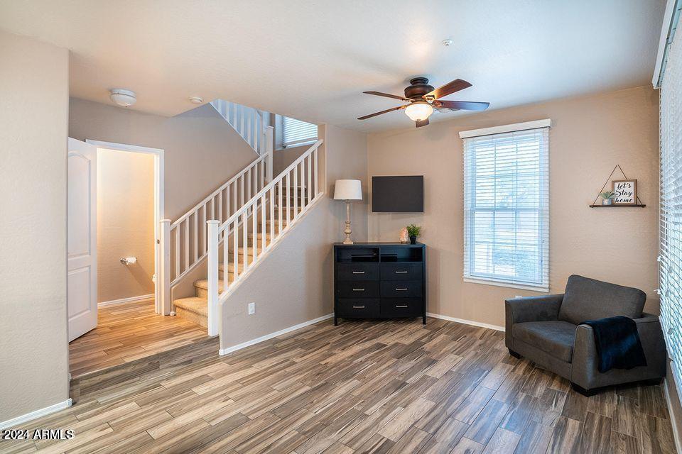 4757 East Waterman Street, Unit 103 Gilbert, AZ 85297 - Photo 4 of 27 a living room with furniture and a window