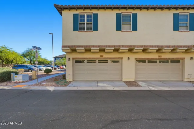 a front view of a house with garage