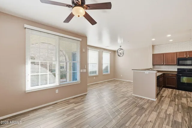 a view of kitchen with furniture and wooden floor