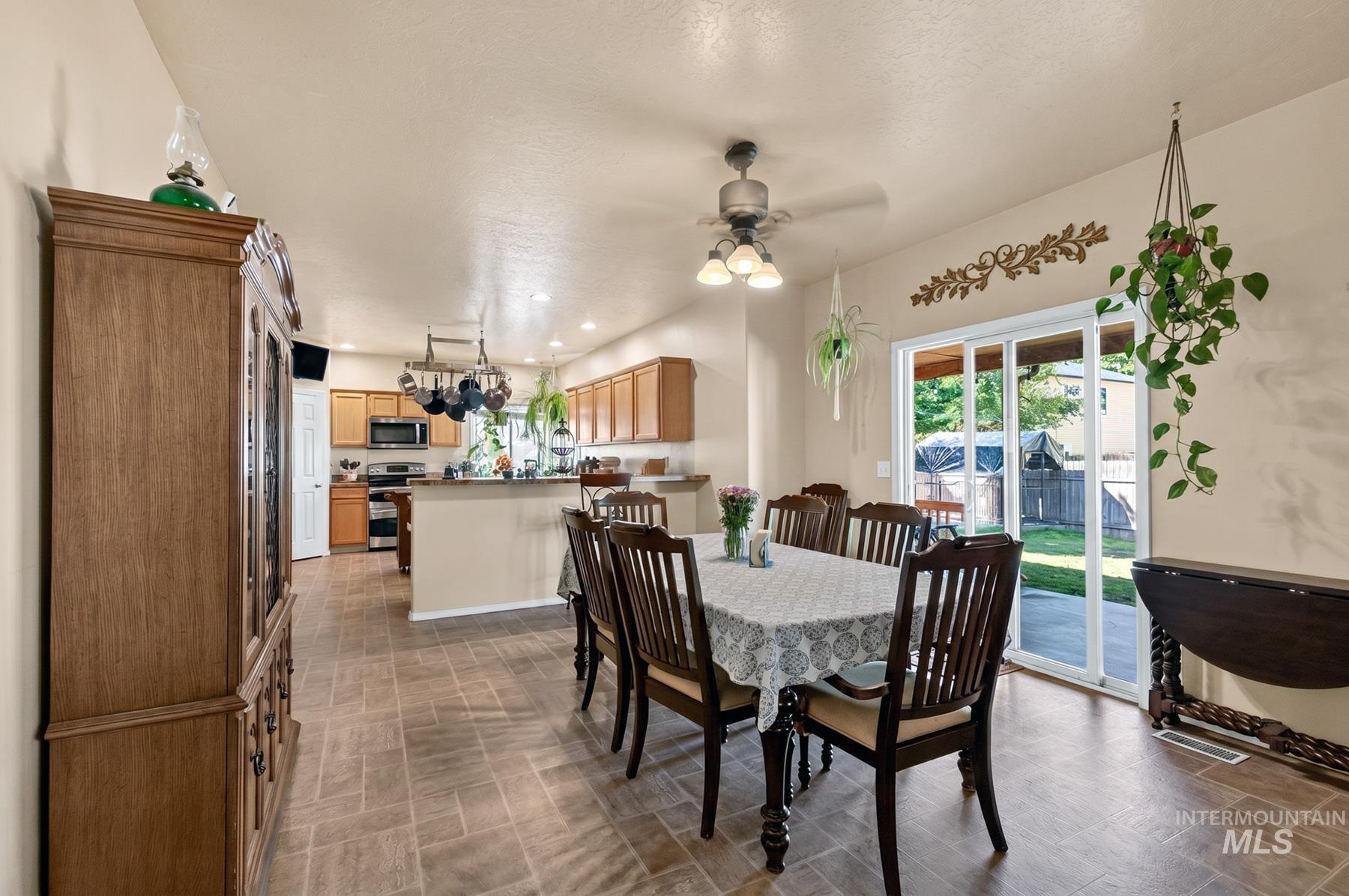 5020 Northrup Way Caldwell, ID 83607 - Photo 11 of 36 Tile flooring extends from the dining area into the kitchen