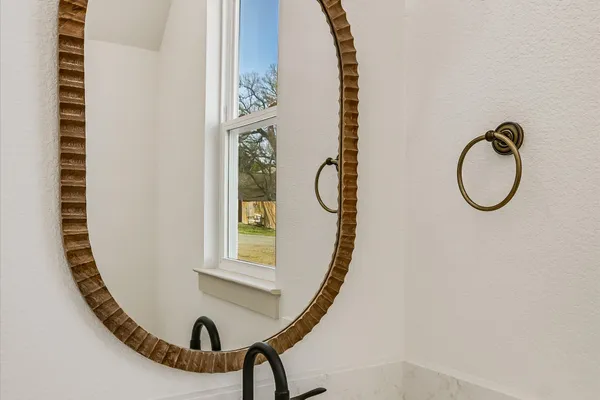 a view of a mirror in a bathroom