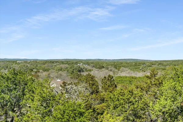 a view of a field with an ocean