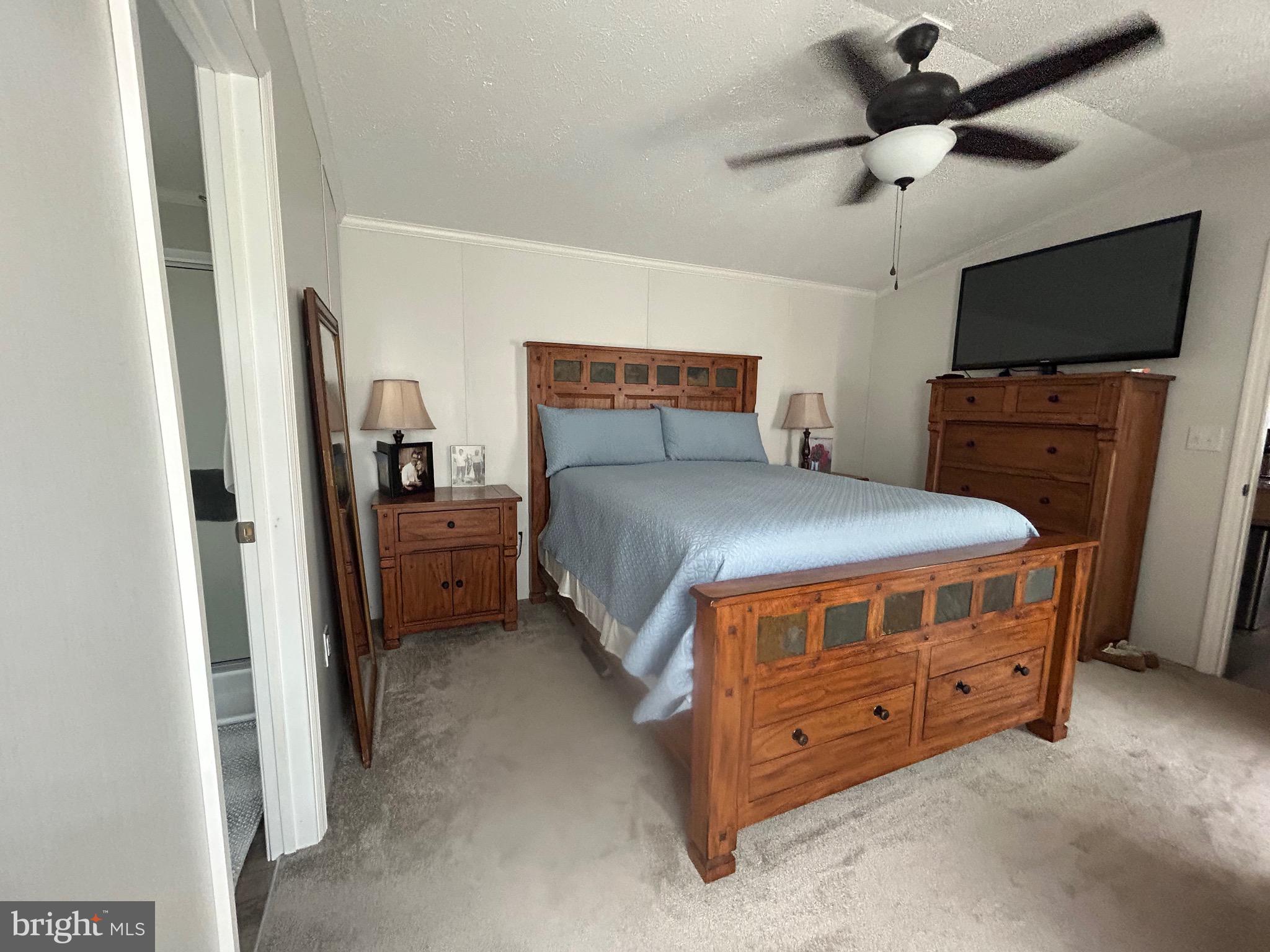 18 Jade Drive Lititz, PA 17543 - Photo 28 of 39 a bedroom with a bed and a flat tv screen on dresser