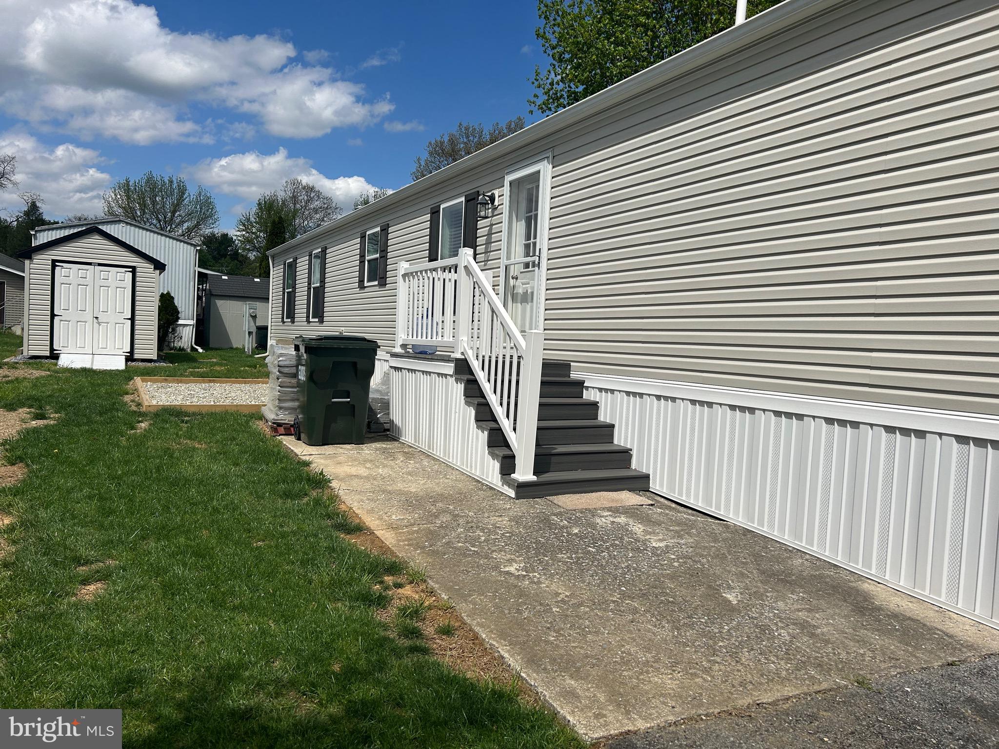 18 Jade Drive Lititz, PA 17543 - Photo 4 of 39 a view of a white house with a yard and stairs
