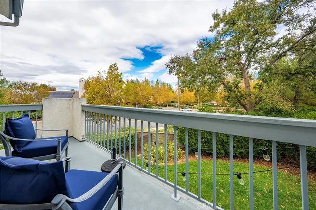 a view of a chair and tables front of the house