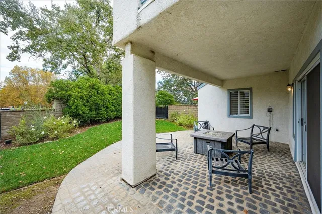 a view of a patio with a garden
