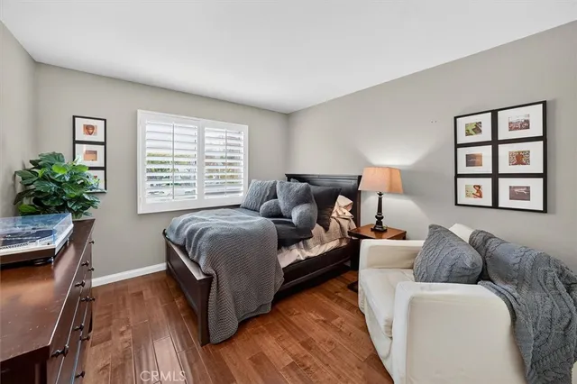 a bed room with a bed window and a couch