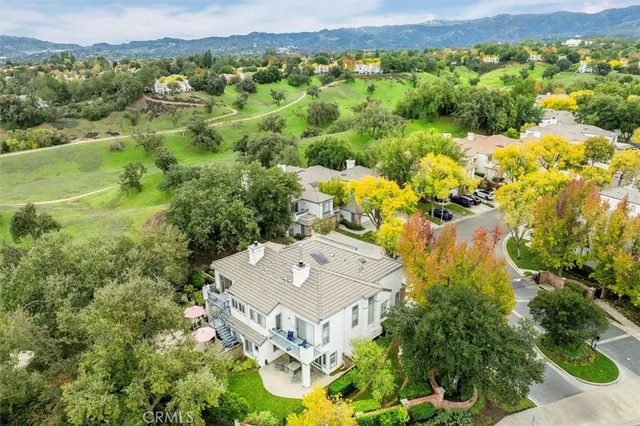 an aerial view of residential house with an outdoor space and balcony