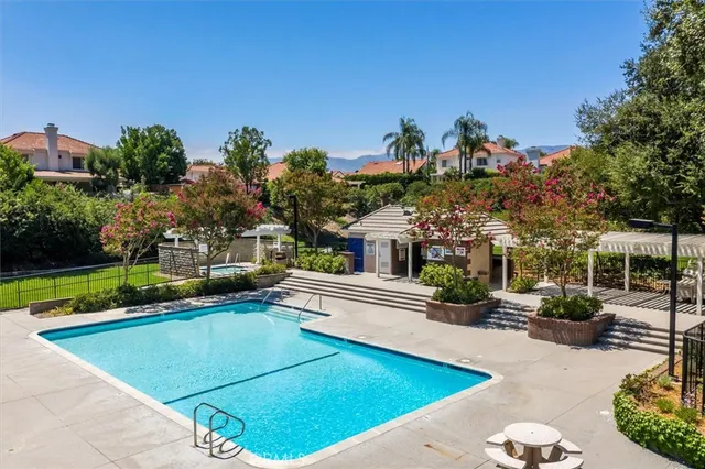 a view of a swimming pool with a patio