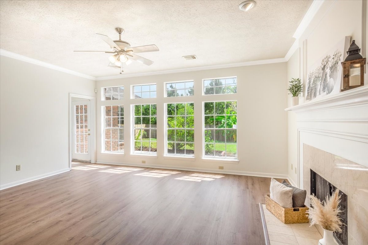 Another view of the bright living room with French doors opening to the backyard.