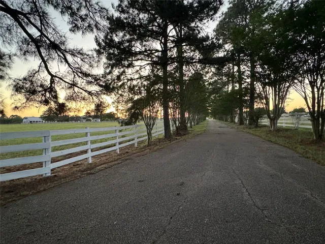 a view of a road with a yard