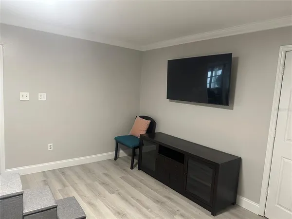 a room with furniture and wooden floor