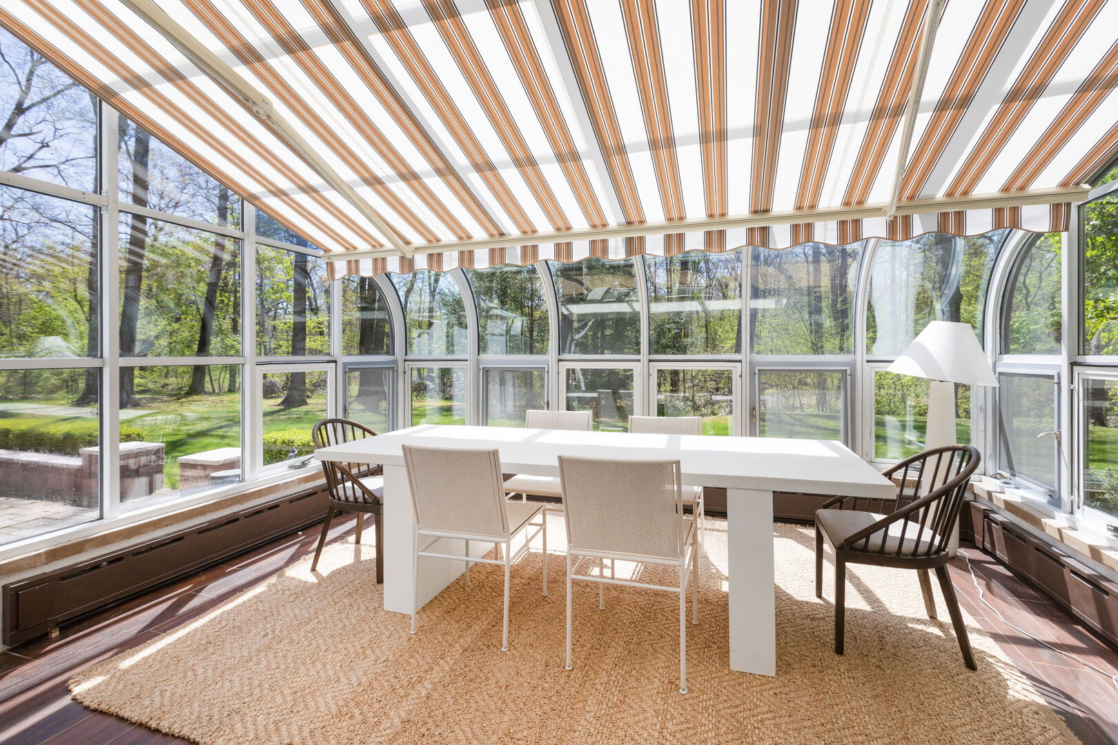 51 South Mayflower Road Lake Forest, IL 60045 - Photo 19 of 64 a dining room with furniture large windows and wooden floor