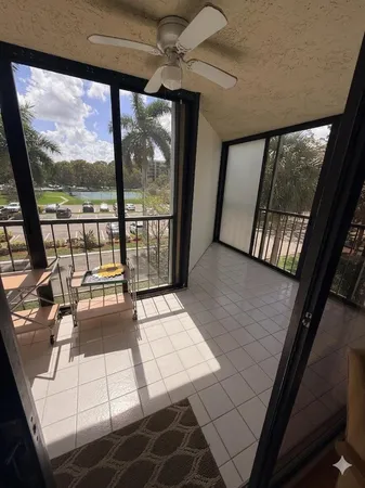 a view of a swimming pool with a patio and a garden