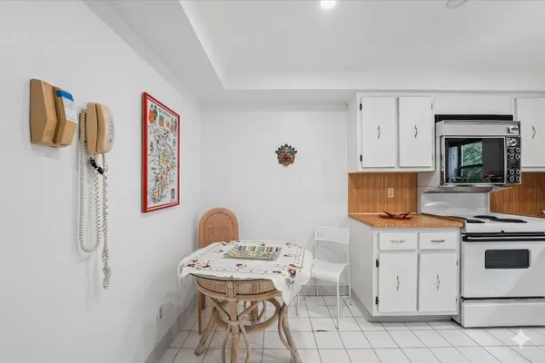 a kitchen with a stove and a microwave