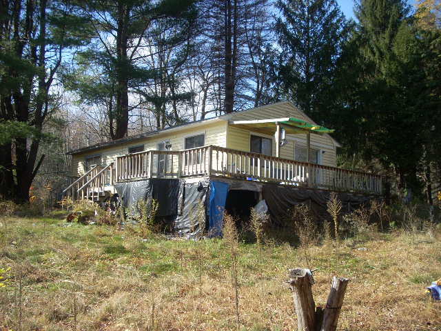269 Otis Road Becket, MA 01223 - Photo 1 of 3 a view of a house with a yard