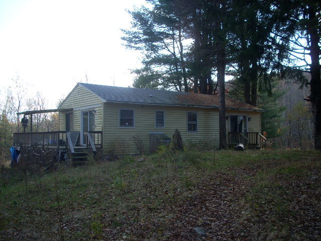 269 Otis Road Becket, MA 01223 - Photo 3 of 3 a backyard of a house with table and chairs