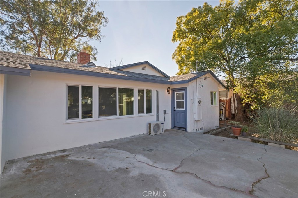 1290 Lomita Road San Bernardino, CA 92405 - Photo 24 of 29 a view of house with a yard and large tree