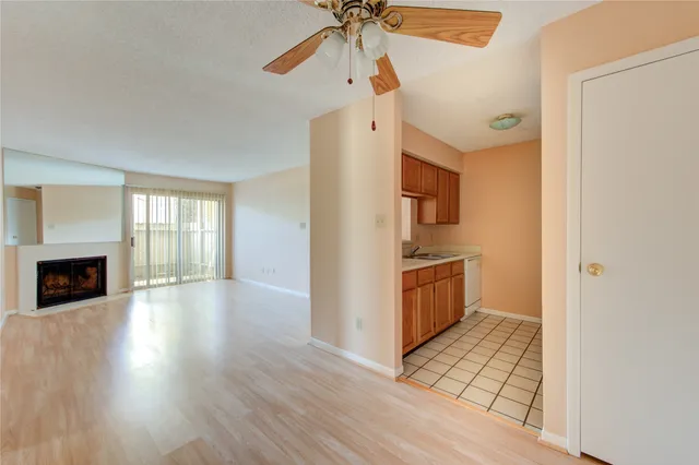 a utility room with cabinets washer and dryer