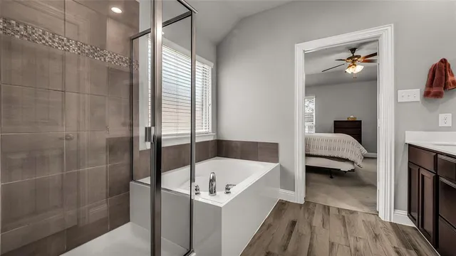 a en suite spacious bathroom with a tub and shower