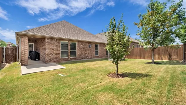 a house view with swimming pool in front of it