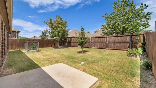 a view of backyard of a house