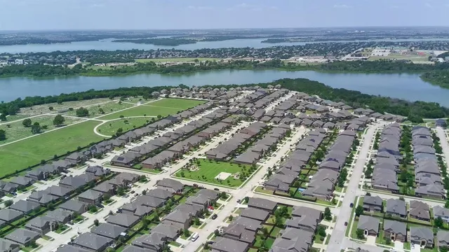 an aerial view of a city and lake view