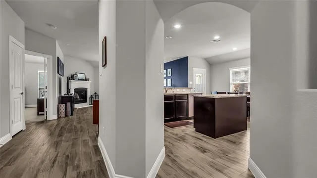 a view of living room with furniture and wooden floor