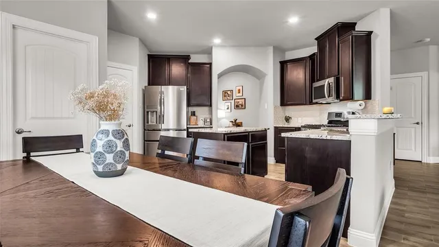 a kitchen with counter top space cabinets and stainless steel appliances
