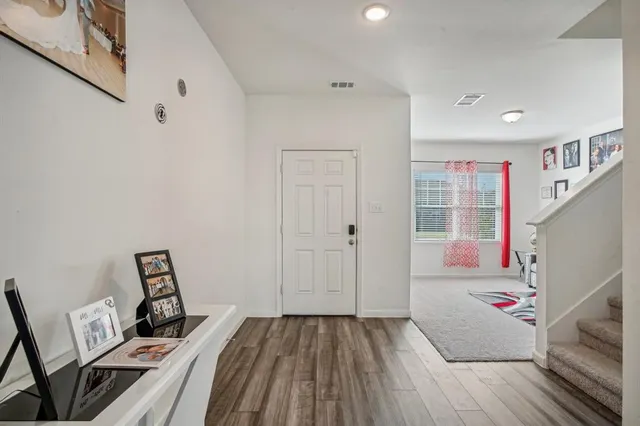 a view of kitchen with furniture and wooden floor