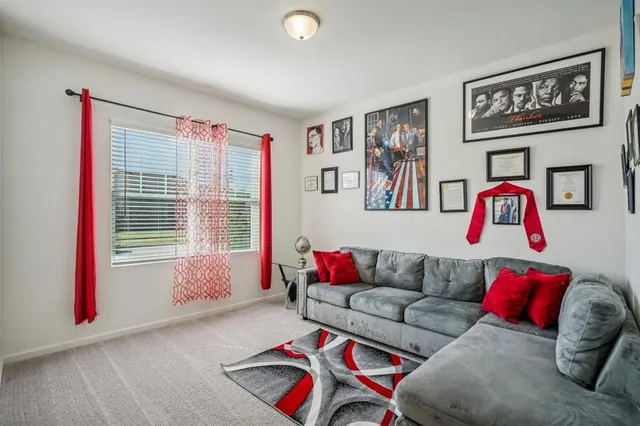 a living room with furniture and a window