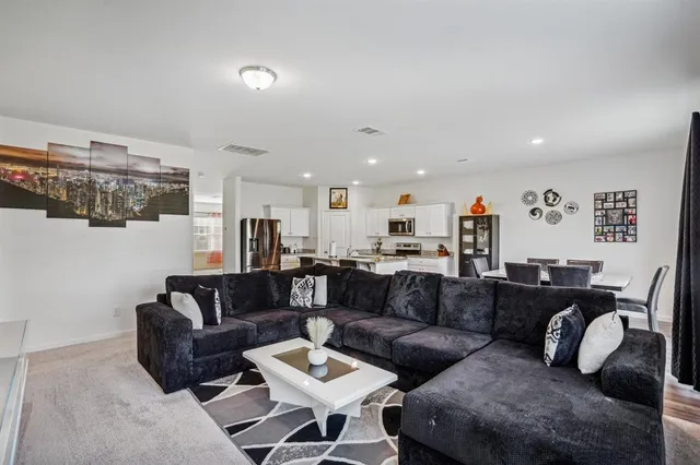 a living room with furniture and a view