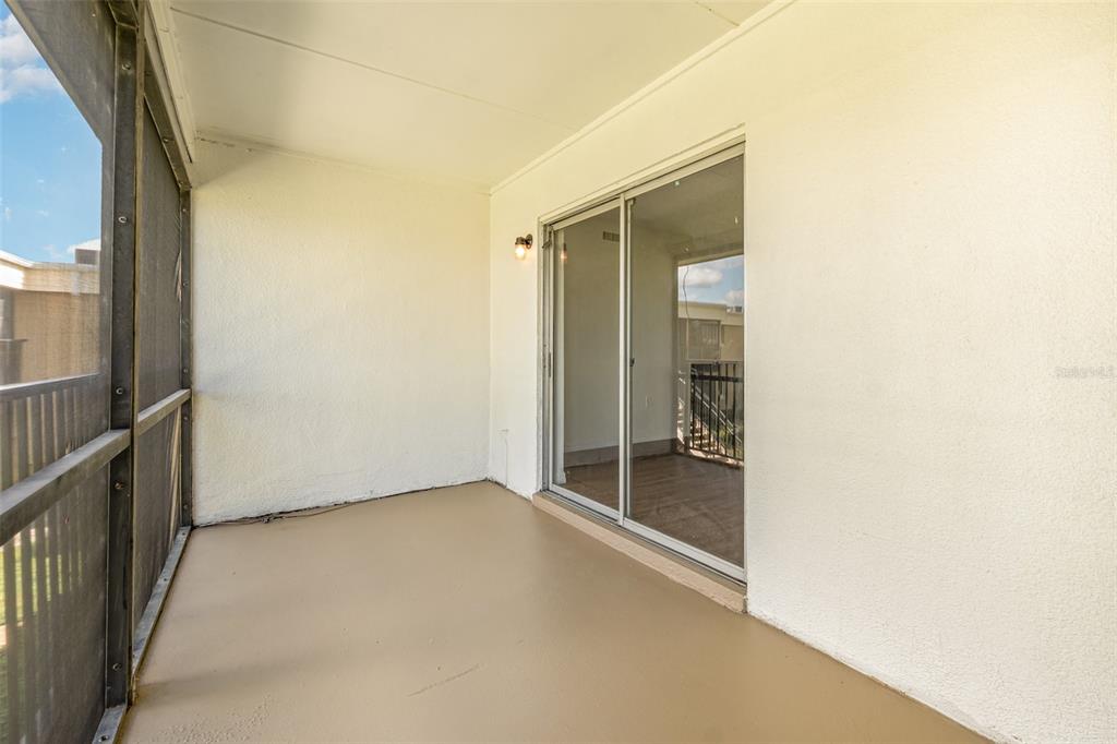 1000 Lake Of The Woods Boulevard, Unit E206 Fern Park, FL 32730 - Photo 16 of 17 an empty room with glass door