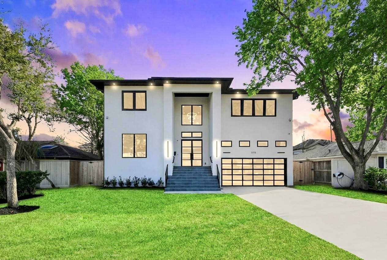 5115 Maple Street Bellaire, TX 77401 - Photo 1 of 45 Welcome to 5115 Maple Street! A contemporary façade illuminated at dusk, showcasing clean architectural lines, expansive windows, and dramatic entry steps that create an unforgettable first impression.