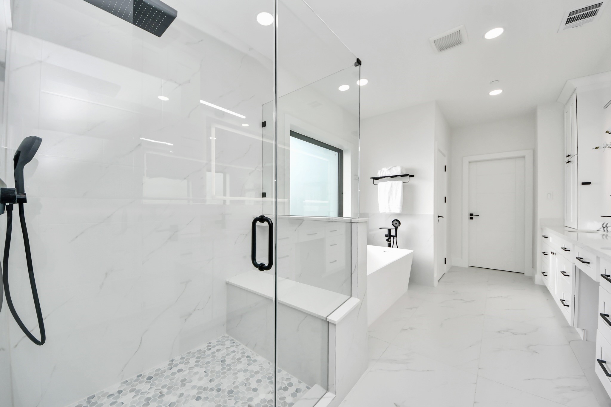 5115 Maple Street Bellaire, TX 77401 - Photo 30 of 45 The suite seamlessly connects to a light and bright spa-inspired bathroom.