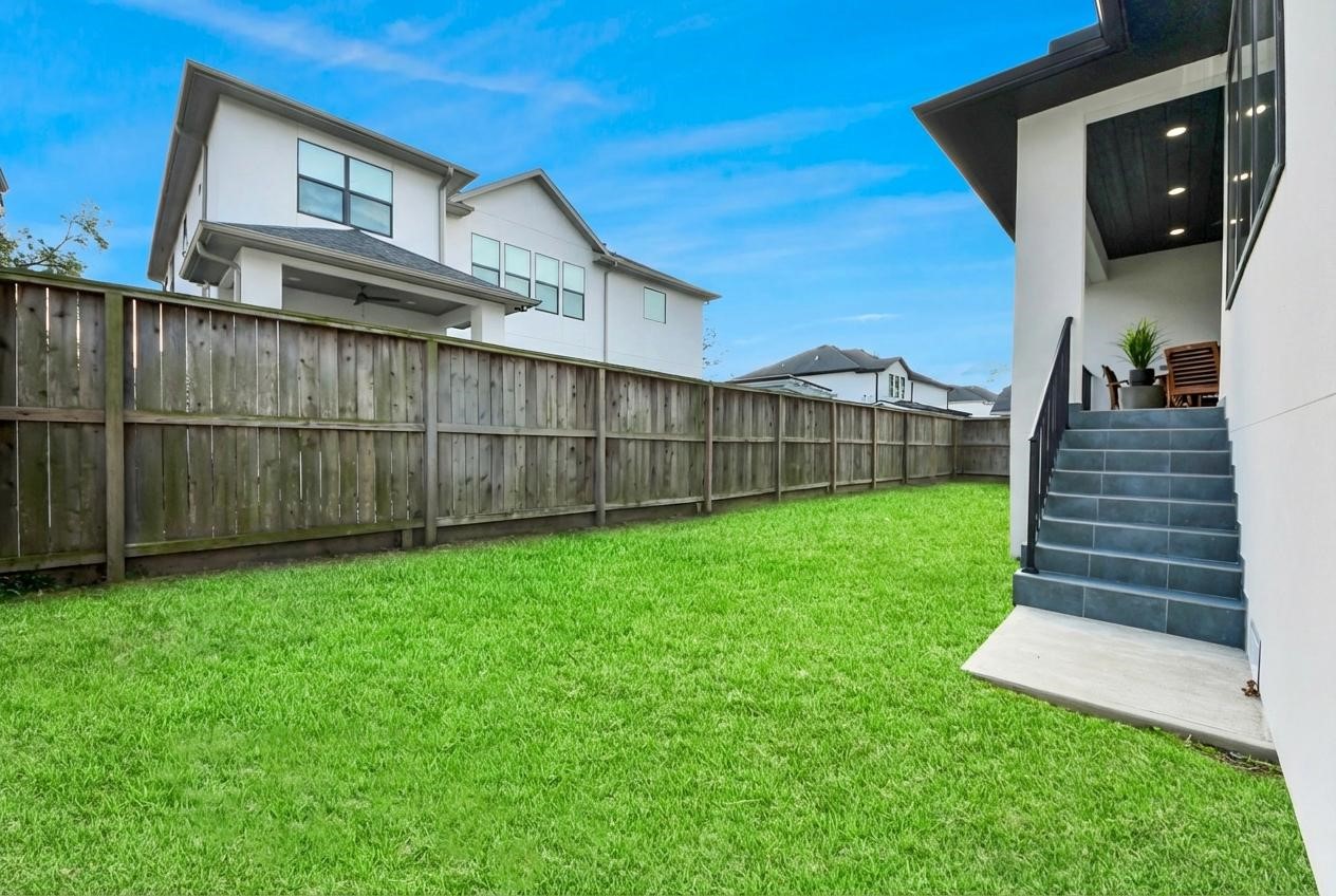 5115 Maple Street Bellaire, TX 77401 - Photo 43 of 45 The backyard provides a serene outdoor escape for quiet, peaceful evenings.